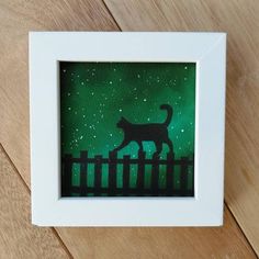 a painting of a cat standing on a fence with stars in the sky behind it