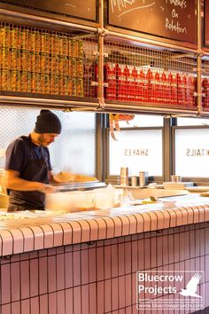 a man working behind the counter in a restaurant