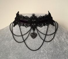 Black lace gothic choker featuring a dark purple velvet and black chains design and a heart pendant in the middle. Lace is 4cm in the widest part. This piece fastens with a clasp and 5cm chain at the back. It is to fit neck sizes from 12 to 14.7 inches (31-36cm). If these measurements do not fit you, send me your measurements with your order. This choker is light and not heavy on the neck. I offer FREE product customization. Therefore customized products or choker lengths are available at no ext Purple Choker, Gothic Choker Necklace, Choker Necklace Designs, Goth Necklace