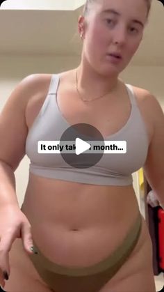 a woman is showing off her stomach and has an ad for it on the screen