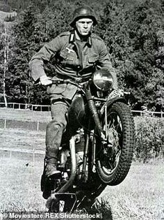 a man riding on the back of a motorcycle