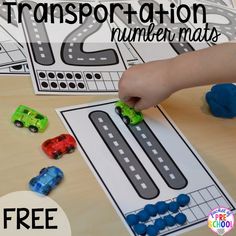 a child is playing with transportation numbers mats