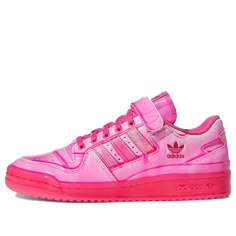 The Jeremy Scott x adidas Forum Dipped Low 'Solar Pink' is a striking take on the classic hoops shoe. The upper is crafted from glossy leather with a monochrome hot pink finish, while the low-profile silhouette is secured with standard lace closure and an adjustable hook-and-loop strap. A cushioning EVA wedge is housed within a fuchsia-colored translucent rubber cupsole for a pop of color, delivering a lightweight feel with every step. Colorful Gym Shoes, Custom Adidas Superstar, Hot Pink Sneakers, Jeremy Scott Adidas, Nike Shoes Women Fashion, Adidas Art, Adidas Forum Low, Forum Low, Profile Silhouette