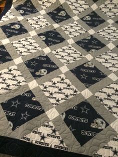 a quilt with the cowboys logo on it