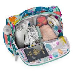 an open travel bag filled with personal items