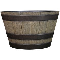 a large wooden basket with leather straps on the bottom and sides, isolated against a white background