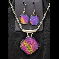 You Are Viewing: Standout Of Modern Design Rula Glass Vintage 925 Solid Sterling Silver Pendant And Sterling Silver Wire-Wrapped Earrings Set, Containing Dichroic Glass That Consists Of Rich Pink, Purple & Yellow Colors, And Black Glass On The Back. My Late Wife Of 17 Years Was A Renowned Silversmith And Glass Artisan, Who Made Wire-Wrapped Pendants And Earrings, Solid Sterling Bracelets And Earrings, Etc. This Is One Of The Pieces That Was Held Back As A Display Model, For Art Shows Throughout Purple Glass Beads For Jewelry Crafting, Purple Glass Jewelry For Jewelry Making, Nickel-free Purple Glass Jewelry, Purple Rectangular Jewelry For Party, Elegant Rectangular Iridescent Jewelry, Elegant Iridescent Rectangular Jewelry, Pendant Earrings Set, Art Shows, Wrapped Earrings