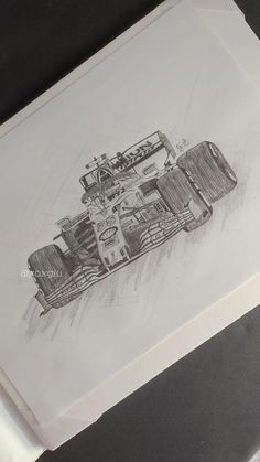 a pencil drawing of a racing car on paper