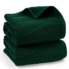 stack of green towels folded on top of each other