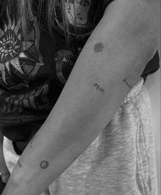 a black and white photo of a woman's arm with the word love on it