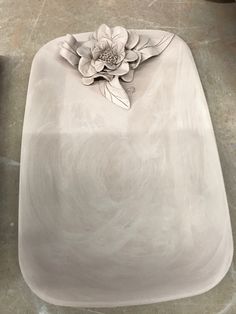 a white sink sitting on top of a counter