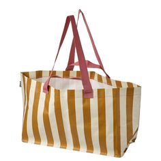 a brown and white striped bag with pink handles