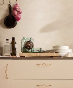 a kitchen counter topped with lots of clutter