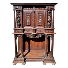 an old wooden cabinet with carvings on the front and side doors, isolated against a white background