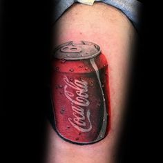 a man with a tattoo on his arm that has a can of soda in it