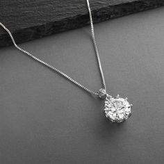 Bridal, Prom or Bridesmaids Bling CZ Necklace Pendant This 1/2" round 5 Ct. Cubic Zirconia Pendant has the brilliance of a genuine diamond! Our CZ is set in Genuine Rhodium for the look of Platinum. Brides, bridesmaids, mothers of the brides & prom girls will turn heads in this 16" - 19" adj. necklace. Womens Necklaces Silver, Silver Bridal Jewellery, Round Diamond Pendant, Long Statement Earrings, Crystal Wedding Jewelry, Pearl Bridal Jewelry, Necklaces Silver, Pearl Jewelry Wedding, Zirconia Necklace