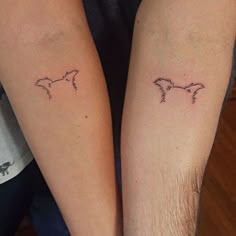 two people with matching tattoos on their arms