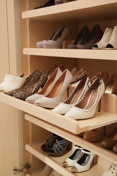 there are many pairs of shoes on the shelves