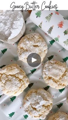 cookies and powdered sugar on a plate with the words gooey butter cookies over it