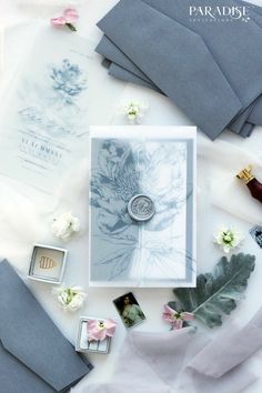 the wedding stationery is laid out on the table