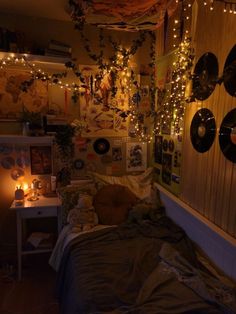 a bedroom with lights strung from the ceiling