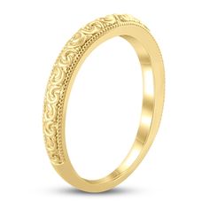 Stylish curlicues of 14K yellow gold are trimmed with delicate milgrain detail in this timeless women's wedding band. Yellow Gold Wedding Ring With Elegant Design, Luxury 14k Gold Wedding Band With Decorative Details, Yellow Gold Bridal Sets For Wedding With Elegant Design, Elegant Yellow Gold Bridal Sets For Anniversary, Elegant Yellow Gold Bridal Sets For Wedding, Classic 14k Gold Wedding Jewelry, Luxury Yellow Gold Rings With Milgrain Detail, Luxury Yellow Gold Rings With Milgrain, Luxury Yellow Gold Milgrain Rings