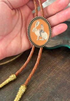 Cowboy Riding Jackrabbit Bolo Tie Gifts for Him Indian Leather Funny Gag Wedding Necktie Mens Necklace Bola Leather Animal Brown Bola Cord - Etsy Western Bolo Tie, Country Rings, Jack Rabbit, Mens Necklace, Tie Gifts, Resin Coating, Cow Boy