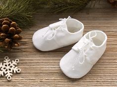 ♥ ESTIMATED DELIVERY TIME (standard or express) AND DELIVERY COSTS ARE CALCULATED AT CHECKOUT. PLEASE READ ITEM DESCRIPTION BEFORE PURCHASING These natural linen baby shoes will be soft and comfortable for your baby's little feet. They are perfect for crawling, playing and taking the very first steps. Perfect for baptism or wedding oufits (please note that the white linen is natural white, not snow white). Adorable gift for a baby shower and new moms. A sweet thing to save in baby's keepsake box White Booties For Baptism, White Closed Toe Booties For Baptism, Handmade White Closed Toe Booties, Ring Bearer Shoes, White Baby Outfit, Boys White Shoes, White Baby Clothes, Baby Boy Linen, Christening Shoes