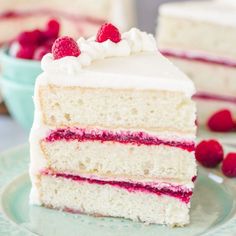 a slice of white cake with raspberry filling on a plate