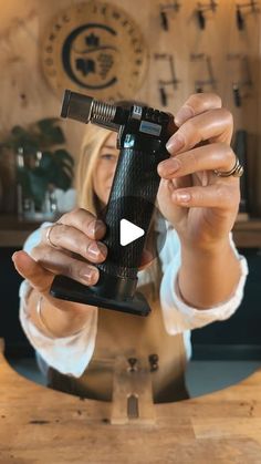 a woman holding up a cell phone in front of her face