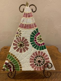 a decorative glass ornament sitting on top of a wooden table