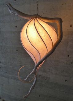 a lamp hanging from the side of a wall