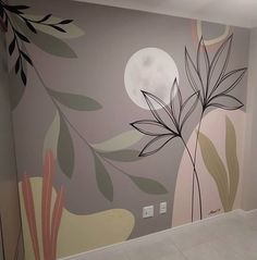 an empty room with a painted mural on the wall