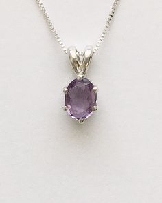 Genuine small oval amethyst measures 7x5mm (3/4 carat) and was handset in sterling silver. Sterling silver box chain is 18 inches long and can be switched out to a 16 inch chain upon request. Necklace is perfect for a child or the minimalist. Comes in a gift box Purple Birthstone Oval Pendant Jewelry, Purple Oval Pendant Birthstone Jewelry, Classic Oval Amethyst Necklaces, Purple Birthstone Oval Pendant Necklace, Oval Amethyst Birthstone Necklaces, Purple Amethyst Oval Pendant Jewelry, Classic Amethyst Oval Pendant Necklace, Oval Purple Birthstone Jewelry, Classic Amethyst Oval Pendant Jewelry