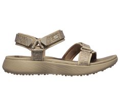 Get ready for a casual afternoon on the course with the Skechers GO GOLF 600 sandal. This sporty casual sandal features heathered jersey straps with a Goga Max cushioned footbed and a golf-style spikeless TPU outsole for added stability. | Skechers Women's GO GOLF 600 Sandal Sandals | Medium Width | High-rebound Goga Max cushioned footbed | 5GEN cushioning midsole features memory retention to help absorb impact | Sandal outsole based on Skechers GO RUN 600 design | Soft heathered jersey knit str Skechers Sandals, Memory Retention, Taupe Sandals, Golf Style, Sporty Casual, Shoe Bags, Golf Fashion, Skechers Women, Skechers Shoes