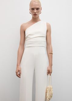 Asymmetrical jumpsuit with draped detail - Woman | MANGO USA Asymmetrical Jumpsuit, Asymmetric Jumpsuit, Shaved Design, Flower Gown, Asymmetric Neckline, Tailored Design, Tailored Dress, Long Jumpsuits, One Piece Suit