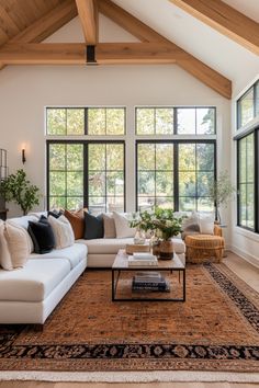 a large living room with lots of windows