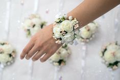 a bride's bouquet is being held by her grooms hands on the wedding day