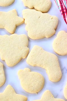 some cookies are laying on a white surface and ready to be cut into pieces or put in the oven