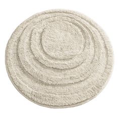 a white rug with four circles on top and one circle in the middle, against a white background