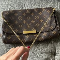 Louis Vuitton Favorite Mm. Authentic. This Bag Is In Excellent Condition. Date Code Sd 2163. Leather Is Beautiful Patina Color Comes W Dust Bag. Comes W Chain Strap And Also Original Leather Strap. This Bag Is Not Sold In Stores Any Longer. Classic And Beautiful. Inside Is Dark Maroon. One Tiny Imperfection/ Stain Shown In Pic. Louis Vuitton Favorite Mm, Favorite Mm, Louis Vuitton Favorite, Patina Color, Dark Maroon, Bags Louis Vuitton, Louis Vuitton Bags, Chain Strap, Louis Vuitton Bag