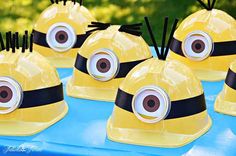 there are many yellow hats with eyes on them