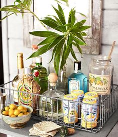 a table topped with bottles and baskets filled with drinks