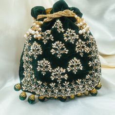 This gorgeous velvet potli with gold embroidery design is that unique and elegant piece you've been looking for!  Perfect for brides and wedding functions!