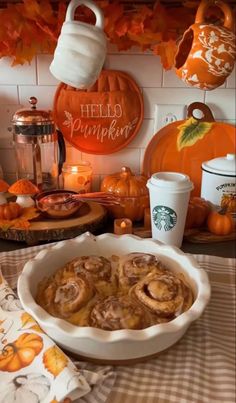 a table topped with pumpkin pies and coffee