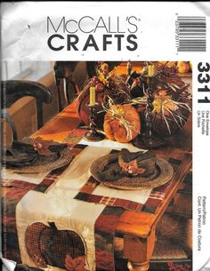 an image of a table setting with fall decorations on it and the words mocalis crafts written in large letters