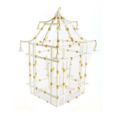 a white and gold cage with lights hanging from it's sides in front of a white background