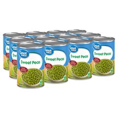 six cans of sweet peas are shown in this image, with the label on it