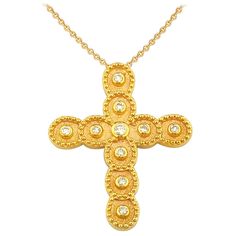 This S.Georgios designer 18 Karat Yellow Gold cross pendant necklace and chain is handmade with microscopically decorated Byzantine-style granulation work and is finished with a unique velvet background look. This beautiful cross pendant necklace features 10 brilliant-cut natural white Diamonds total weight of 0,15 Carats and comes on a 17-inch chain, or can be sent at any length you desire, please contact us. We also custom-make this stunning unique piece in White and Rose Gold, and with different color precious stones. All Georgios Collections jewelry is handmade in our workshop in Athens Greece and is of exquisite quality of workmanship and stone selection. Chain Length: 17.0 inches Long Width: 21.0 mm Length: 25.0 mm Depth: 2.0 mm Weight: 4.60 gr For a full selection of our jewelry ple Luxury Brilliant Cut Cross Pendant Necklace, Velvet Background, Diamond Cross Necklace Gold, Diamond Cross Necklaces, Beautiful Cross, Gold Cross Pendant, Diamond Cross, Gold Cross, Cross Pendant Necklace