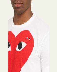 Comme des Garcons Tshirt featuring big heart graphic. Crew neckline. Short sleeves. Straight hem. Pullover style. Cotton. Imported. White Heart Print Top For Streetwear, Cotton Streetwear Top With Heart Shape, Graphic Tee With Heart Print And Crew Neck, Cotton Graphic Tee With Heart Design, White Crew Neck Top With Heart Patch, White Cotton Top With Heart Patch, Cotton Heart-shaped Top For Streetwear, Cotton Graphic Tee With Heart Graphic, Cotton Graphic Tee With Heart Print